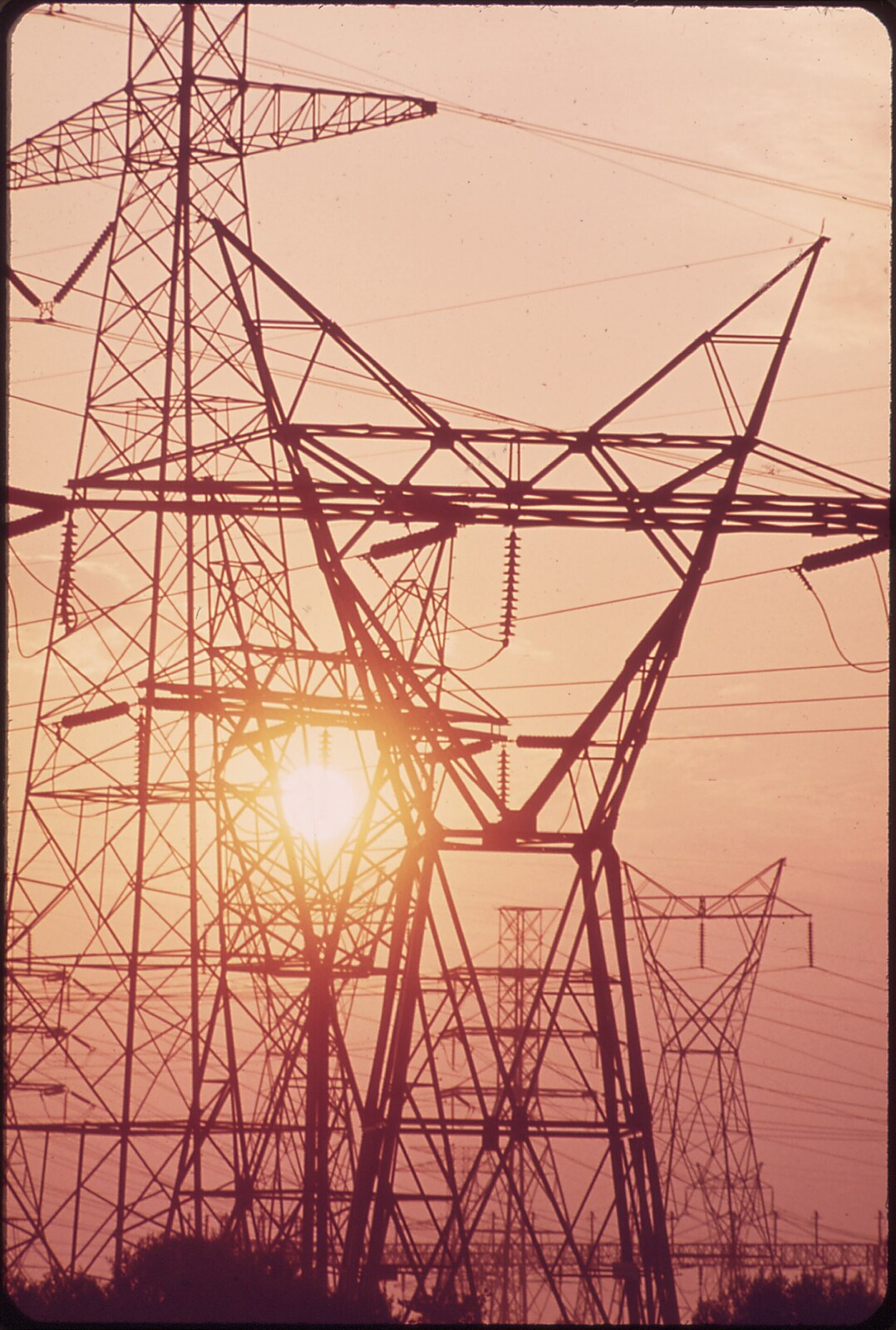 Texas home at dusk with power lines and an electricity bill on a table