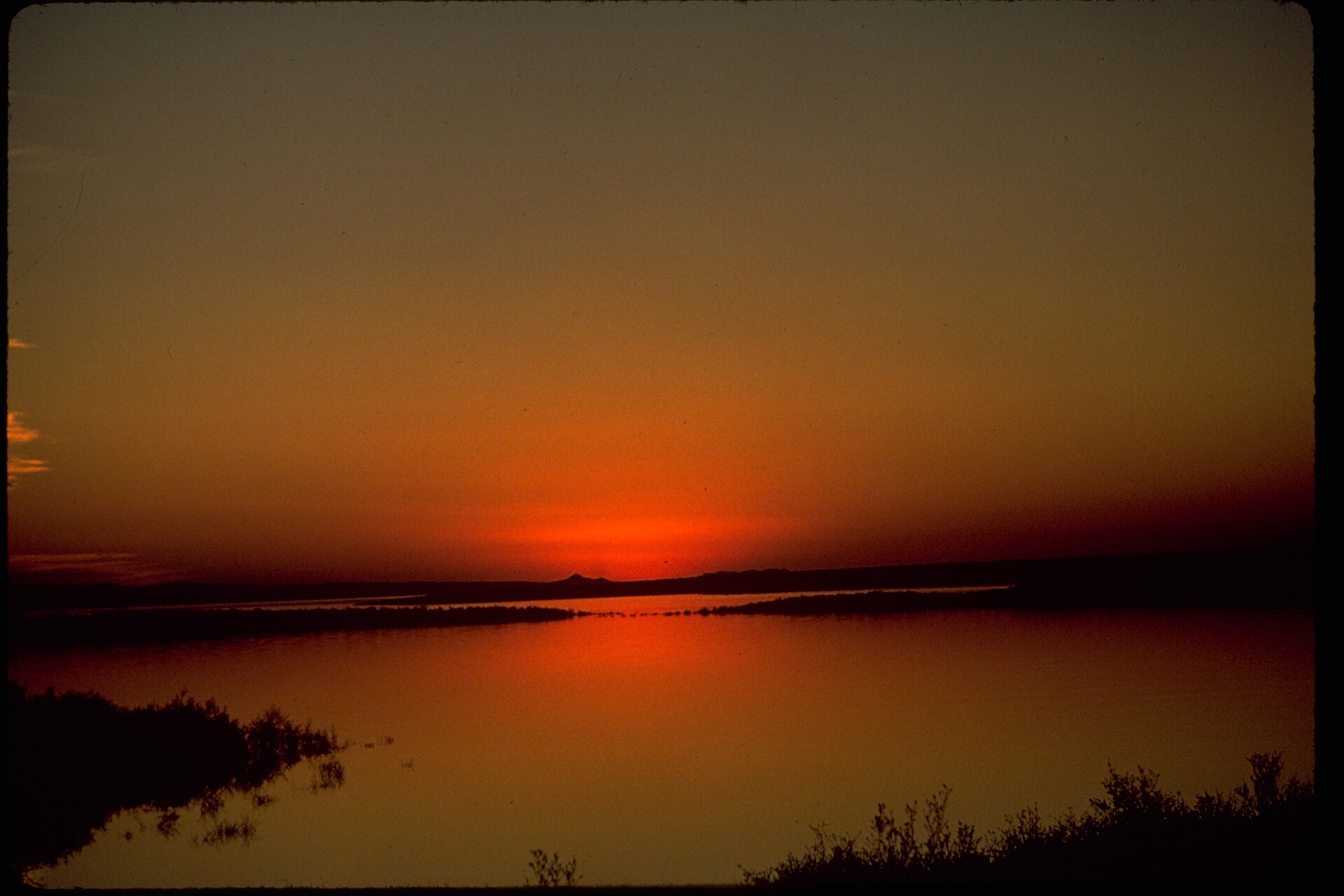 Blue reservoir water and arid canyon landscape in the Rio Grande basin